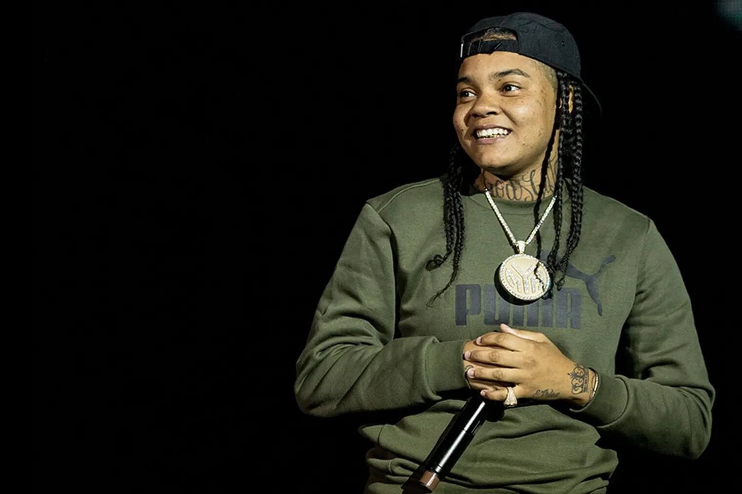 black gay music artist Young MA from Brooklyn,.  Since she got into the rap game which is filled with homophobes she's been open with her sexuality.